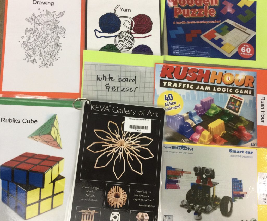 Maker Space items: Rubiks cube, Keva planks, Smart Car, Rush Hour, yarn, drawing